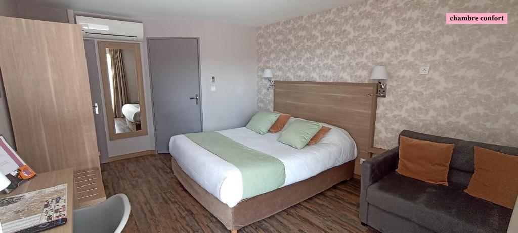 Postel nebo postele na pokoji v ubytování Hôtel Le Clos Badan