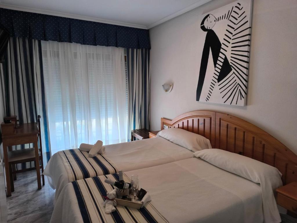 Postel nebo postele na pokoji v ubytování Hotel Arillo