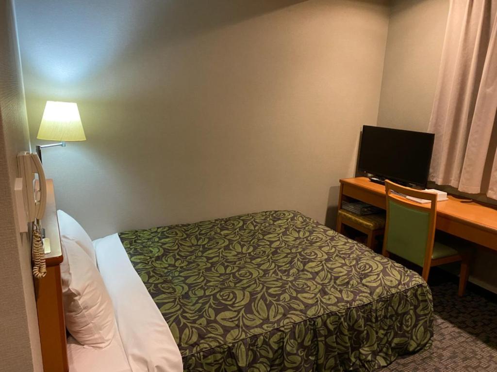 Postel nebo postele na pokoji v ubytování Hotel Sunrise21