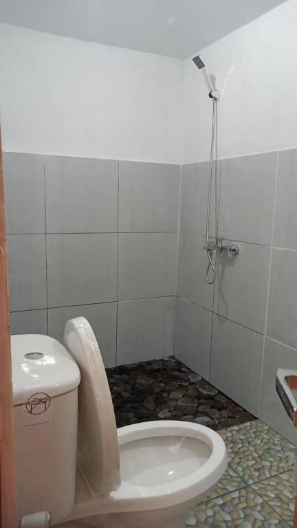 Koupelna v ubytování Bayan Exotic Homestay