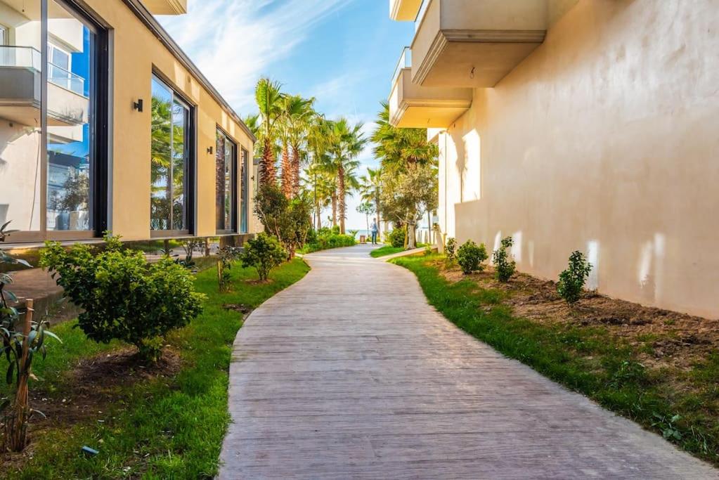 a cobblestone road next to a building at Seaview Luxury Suite by PS in Golem