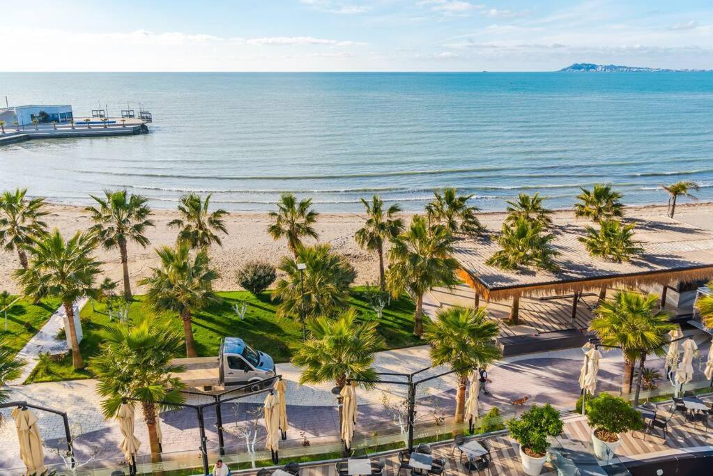 an aerial view of a beach with palm trees and a boat at Seaview Luxury Suite by PS in Golem