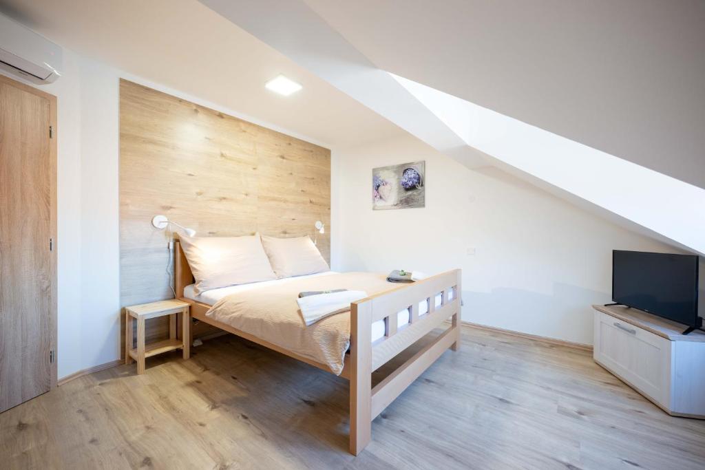 Postel nebo postele na pokoji v ubytování PAPI Apartmán