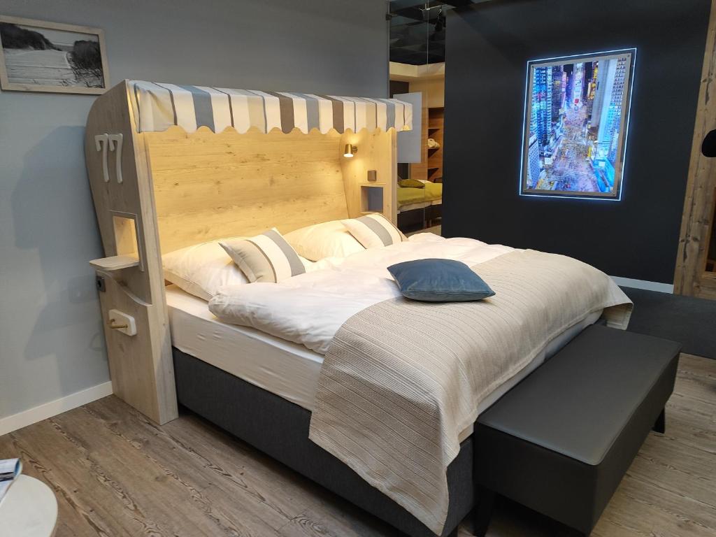 a bedroom with a large bed with a wooden headboard at TERMINAL 1 in Berlin