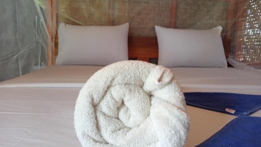 Postel nebo postele na pokoji v ubytování Bayan Exotic Homestay