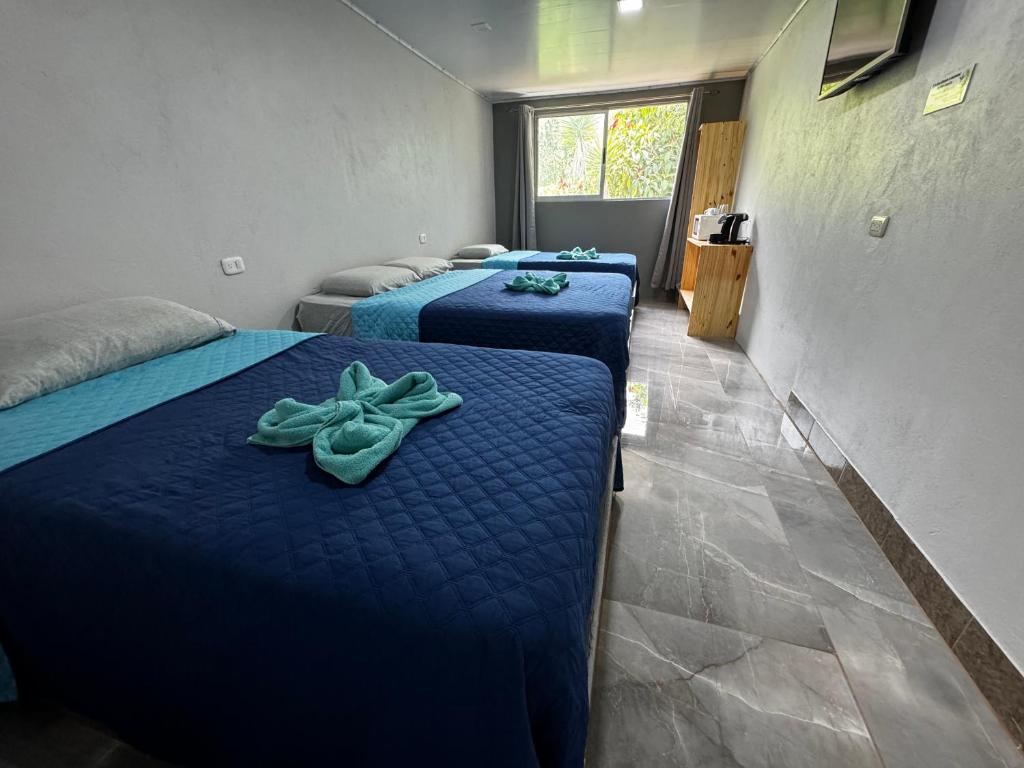 Postel nebo postele na pokoji v ubytování Hotel Uran