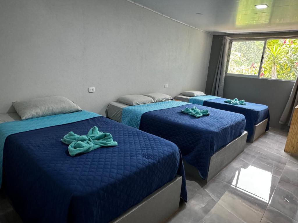 Postel nebo postele na pokoji v ubytování Hotel Uran