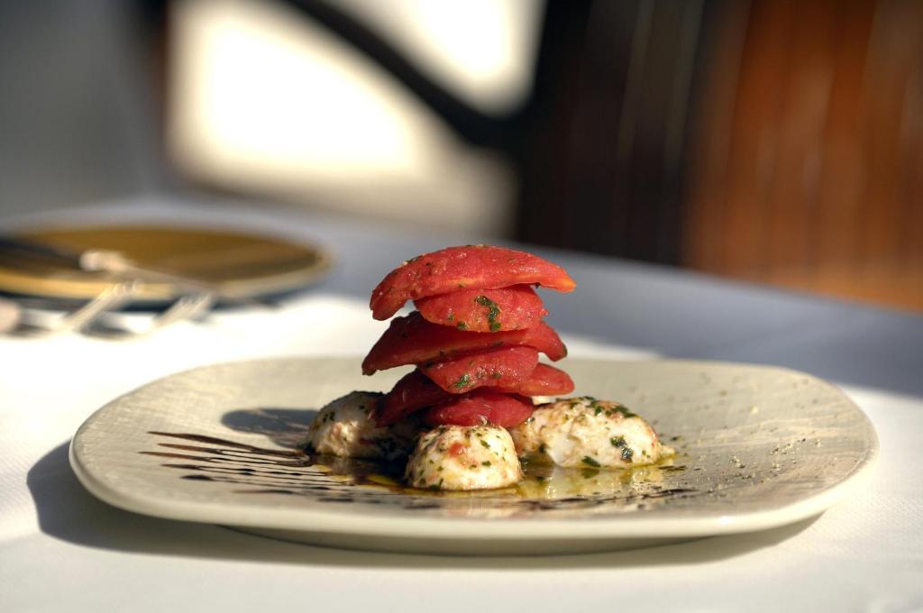 a plate of food with a red mushroom on it at Intercontinental Cairo Citystars by IHG in Cairo