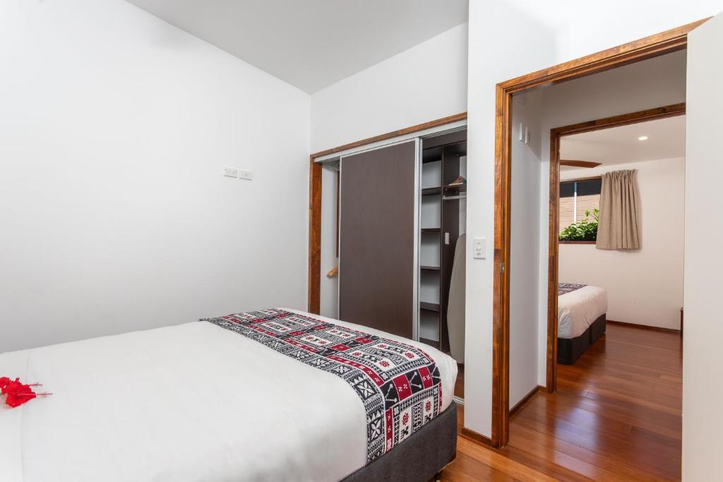 Postel nebo postele na pokoji v ubytování Atupa Suites