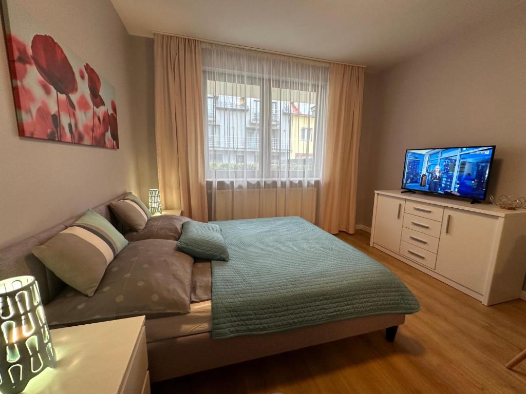 TV a/nebo společenská místnost v ubytování Pokoje i Domki Atlantic