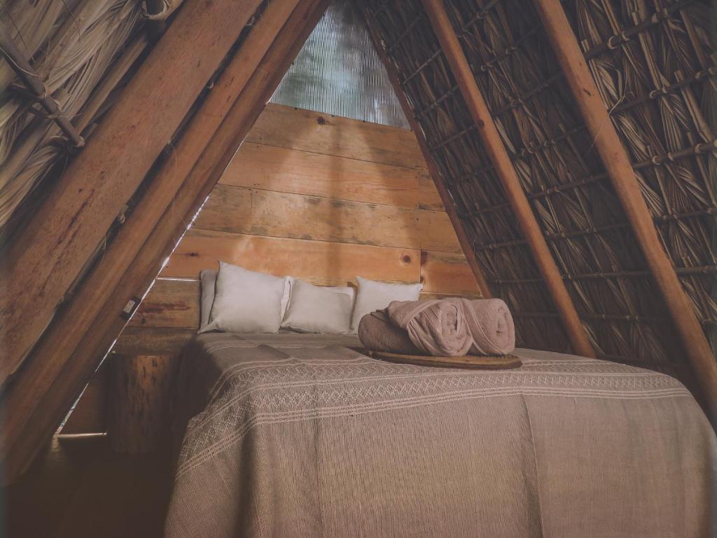Ein Bett oder Betten in einem Zimmer der Unterkunft TRIBU Glamping & beach view