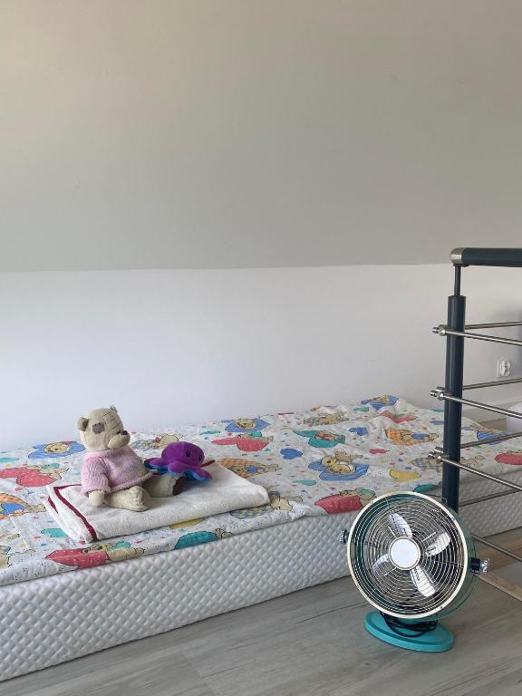 Postel nebo postele na pokoji v ubytování Lazurowy Brzeg