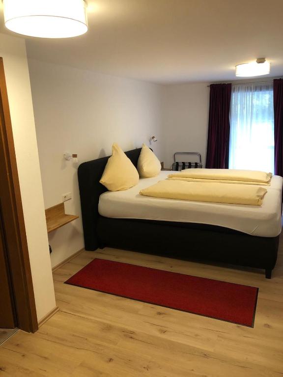Postel nebo postele na pokoji v ubytování Gasthaus Hotel Löffelschmiede