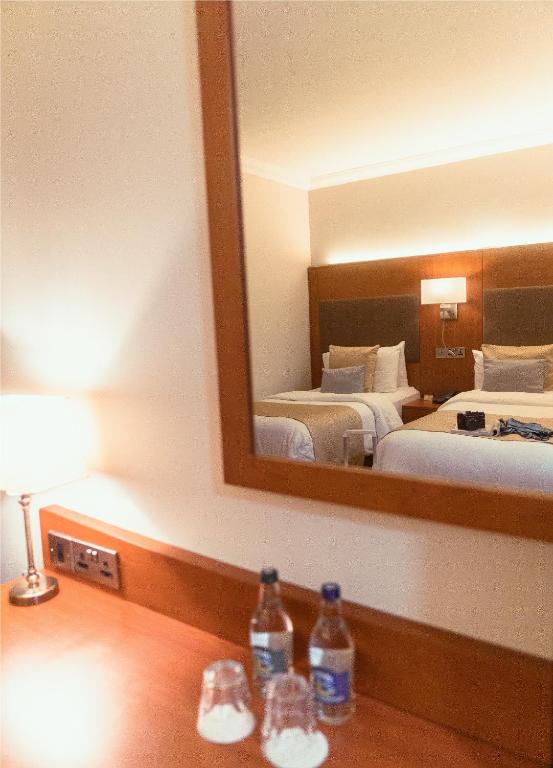 Ένα ή περισσότερα κρεβάτια σε δωμάτιο στο Uppercross House Hotel