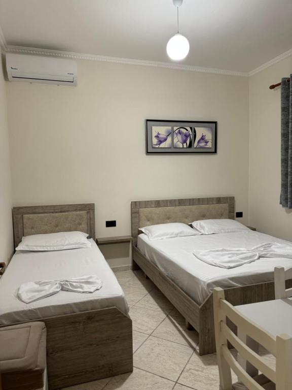 Postel nebo postele na pokoji v ubytování VILA Eljus