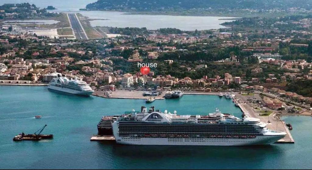 a cruise ship is docked in a harbor at Contessina Al Porto Suite in Mantoúkion