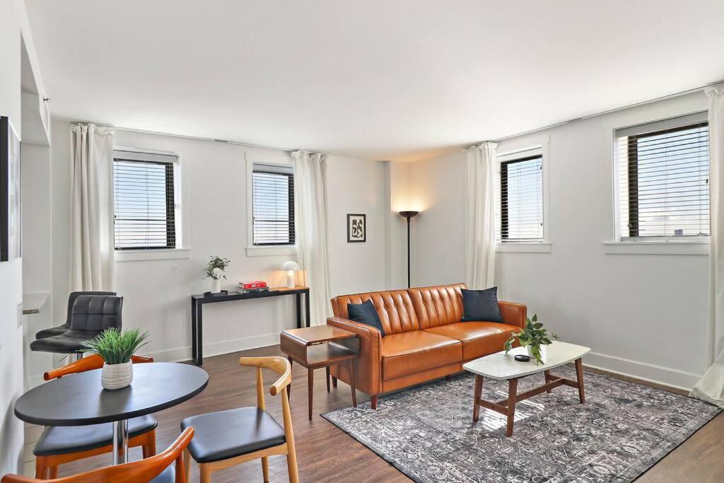 a living room with a couch and a table at Stylish 2BR Retreat in Hyde Park - Shoreland 1320 in Chicago