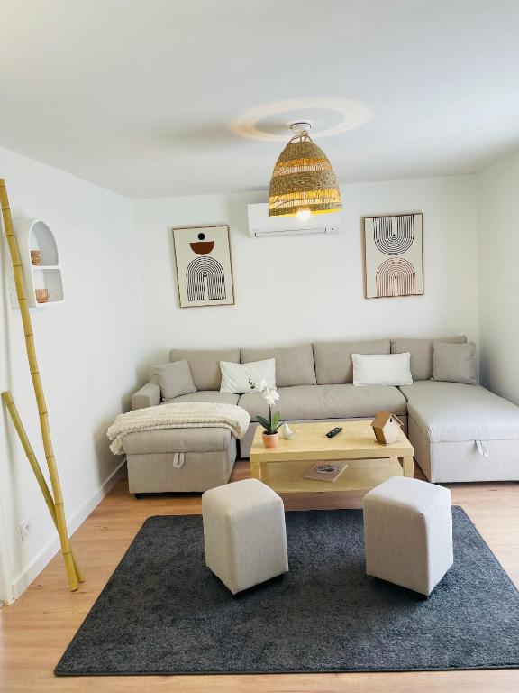 a living room with a couch and a table at Un Mendi in Argelès-Gazost