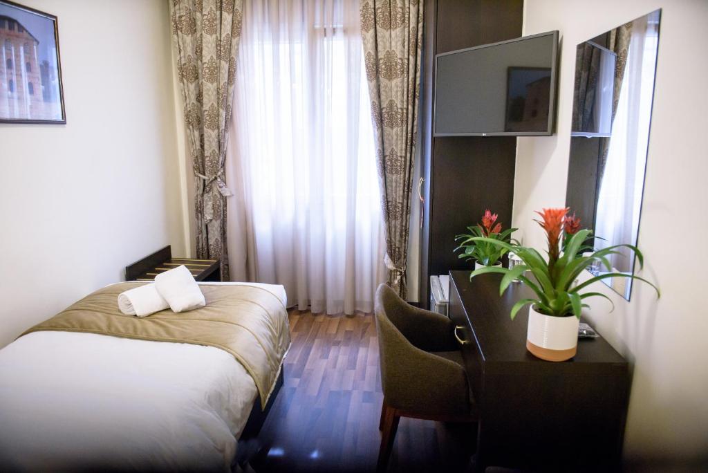 Postel nebo postele na pokoji v ubytování Hotel Padelidaki