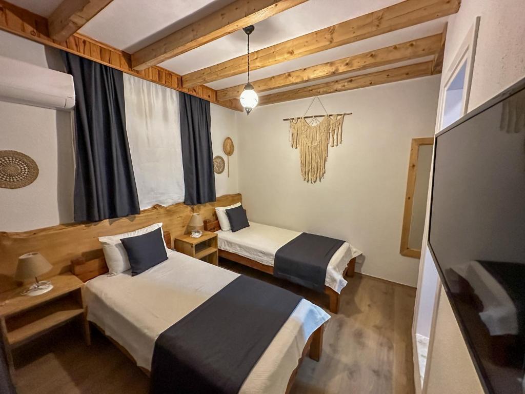 Postel nebo postele na pokoji v ubytování Faralya Misafir Evi
