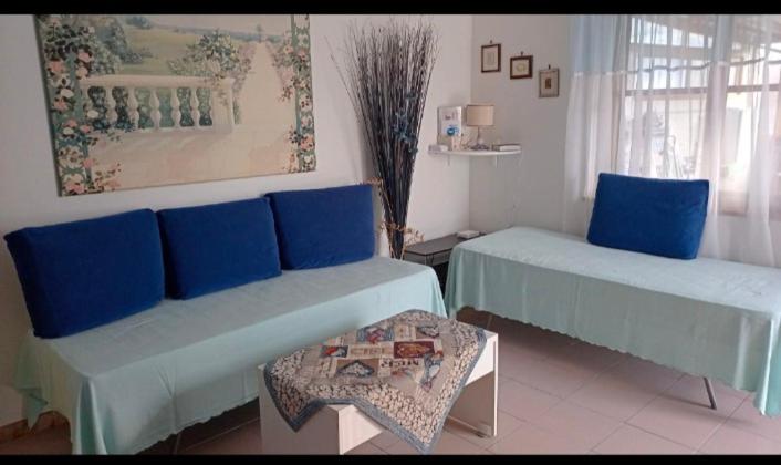 Łóżko lub łóżka w pokoju w obiekcie Country House Gaeta