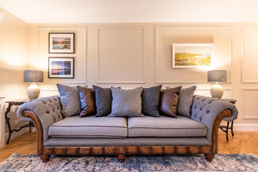 a living room with a couch with pillows at Apartment 91 in Inverness