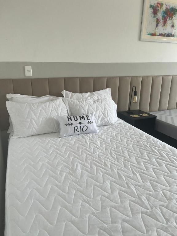 Cama ou camas em um quarto em Home Rio