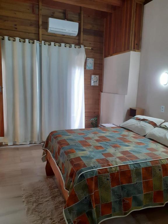 Cama ou camas em um quarto em Pousada Do Chicão