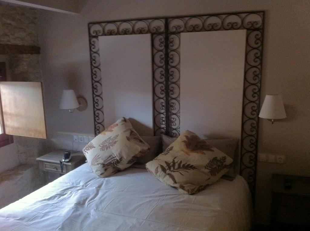 Postel nebo postele na pokoji v ubytování Hotel El Cerco