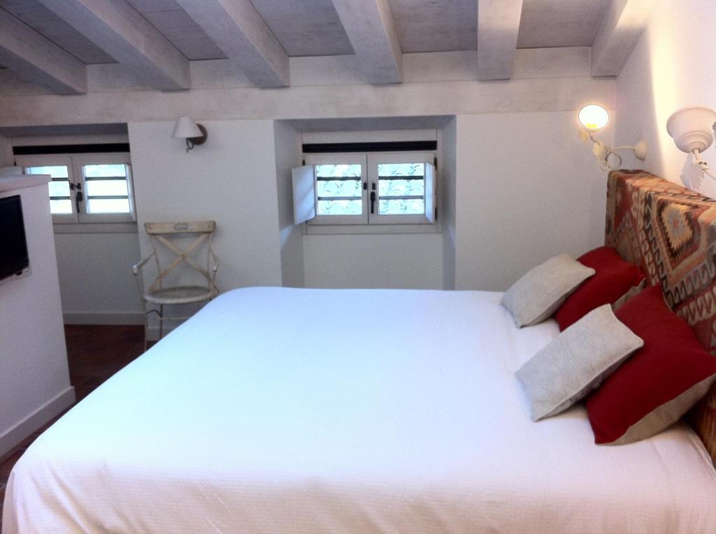 Postel nebo postele na pokoji v ubytování Hotel El Cerco