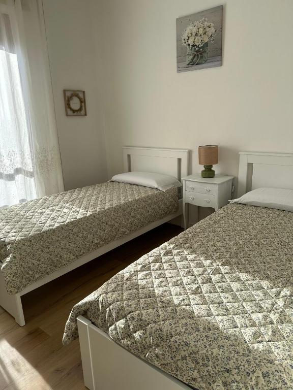 Postel nebo postele na pokoji v ubytování Casa di Maya