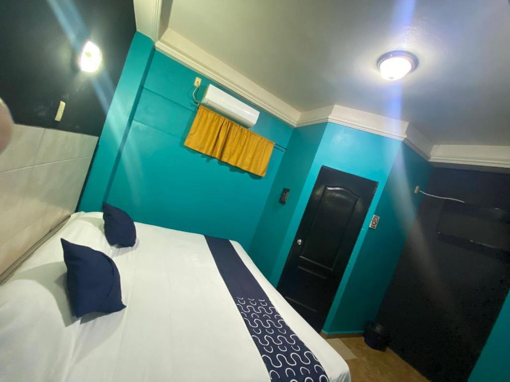 Ένα ή περισσότερα κρεβάτια σε δωμάτιο στο Hotel Torre