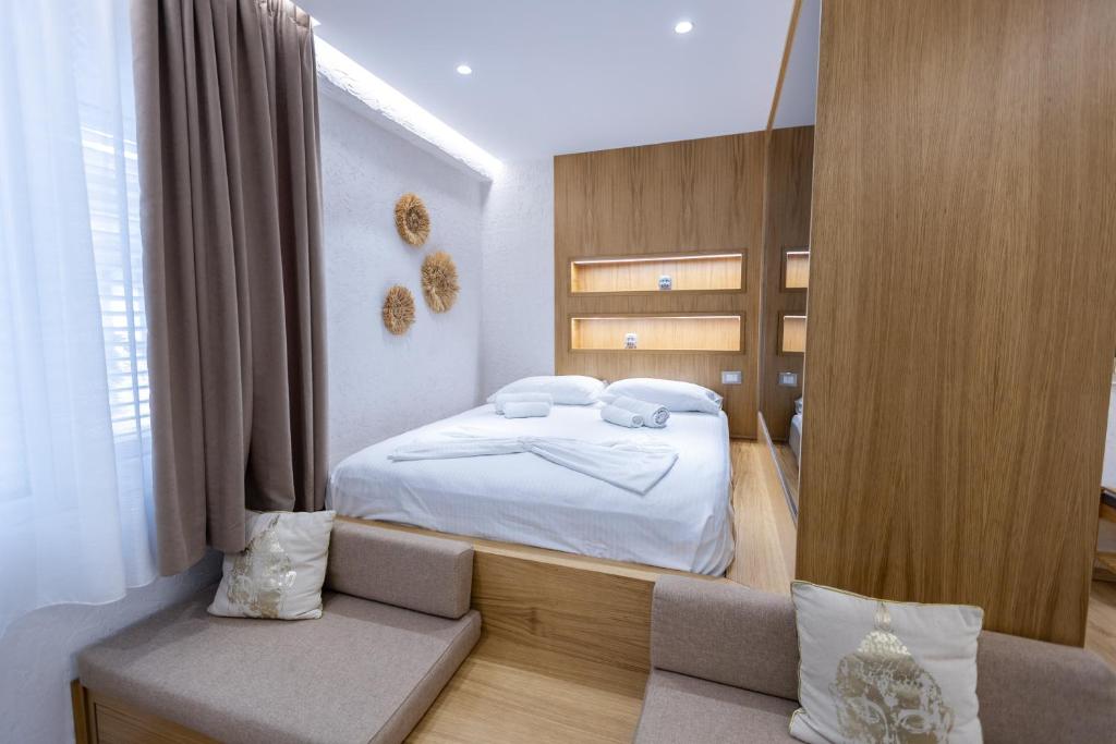 Postel nebo postele na pokoji v ubytování Boho Central Apartment