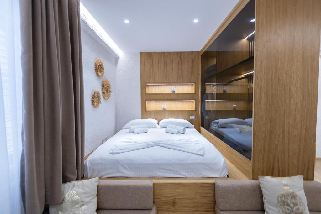 Postel nebo postele na pokoji v ubytování Boho Central Apartment