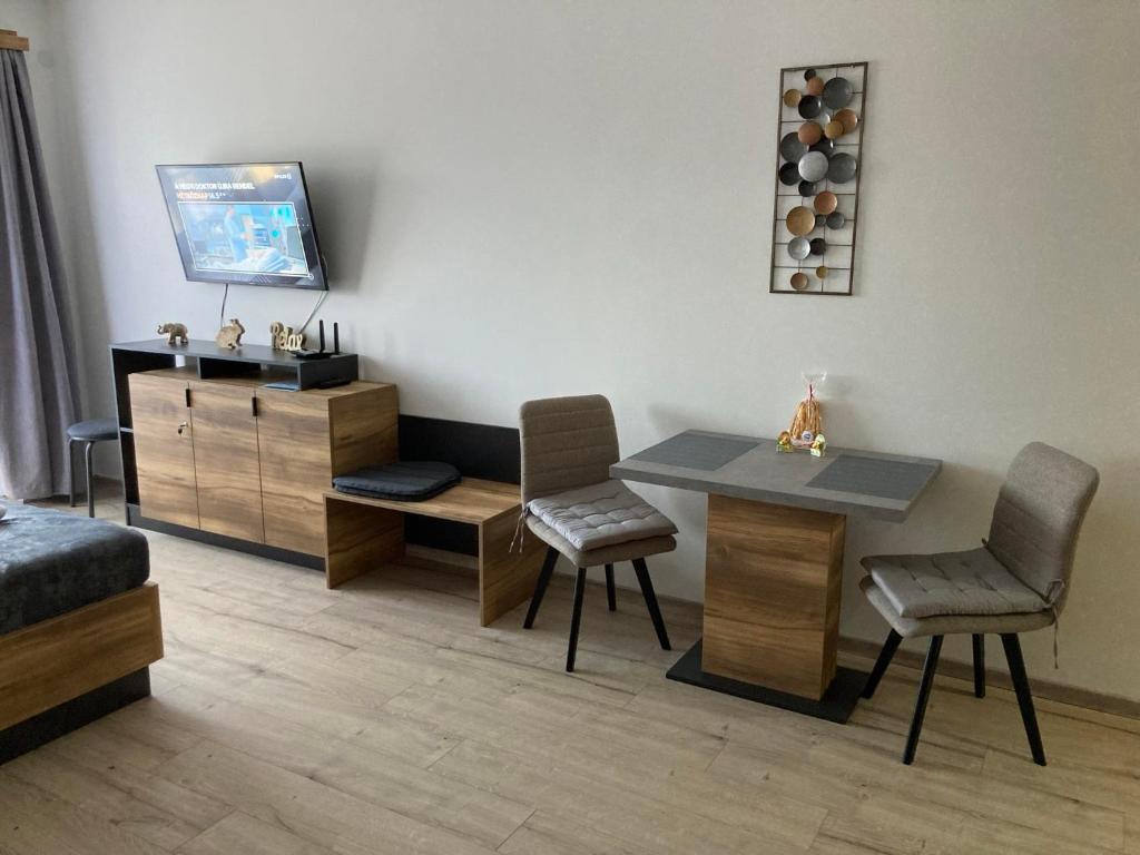 Televiisor ja/või meelelahutuskeskus majutusasutuses D&D Wellness Apartmanok - Dávid Wellness Apartman