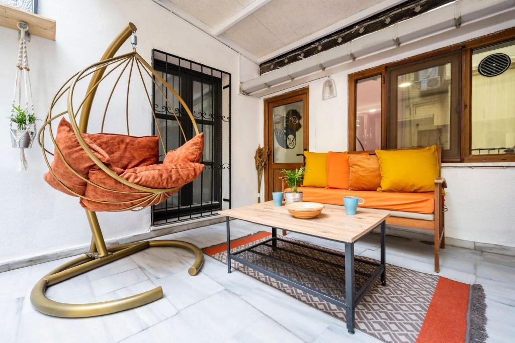 a living room with a swing and a couch at GALATA FİVE APARTMENTS in Istanbul