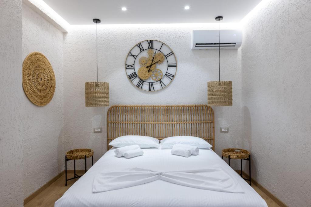 Postel nebo postele na pokoji v ubytování Boho Central Apartment