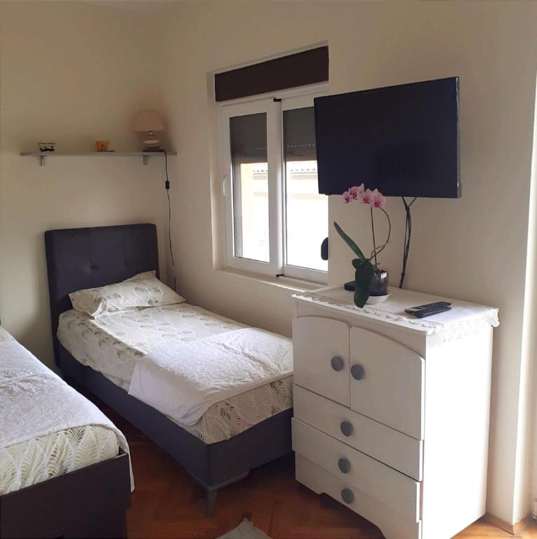 Postel nebo postele na pokoji v ubytování Guesthouse Gavrilović 28 A