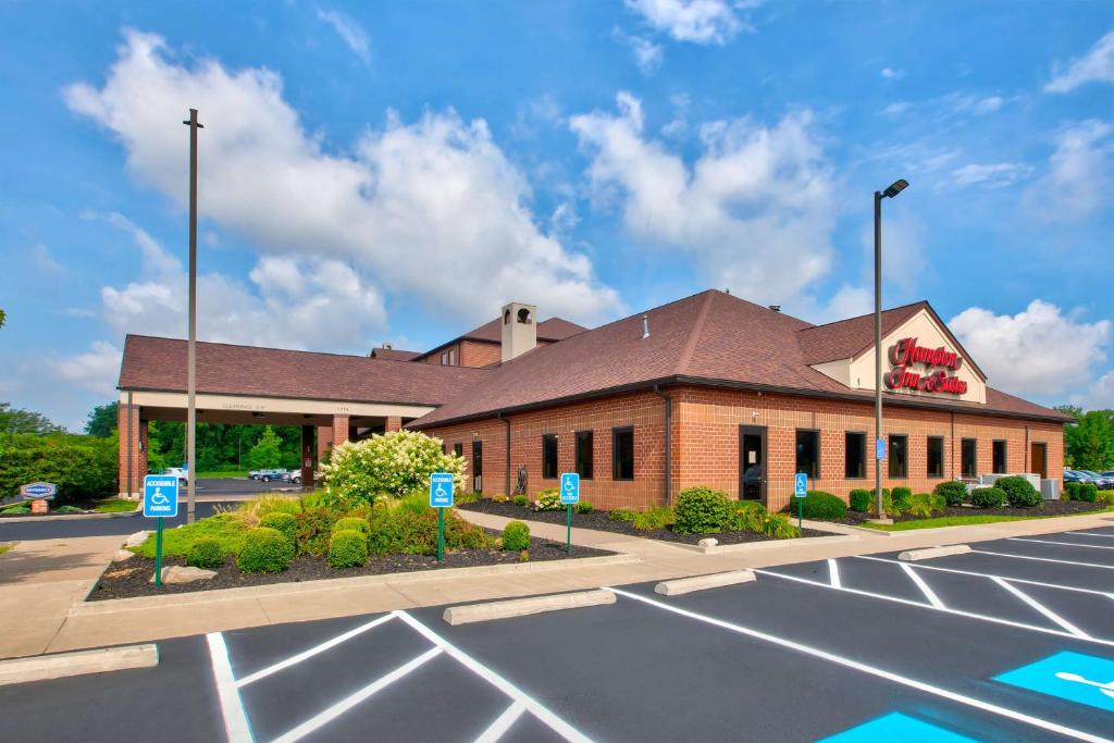 a building with a parking lot in front of it at Hampton Inn & Suites Cleveland-Airport/Middleburg Heights in Middleburg Heights