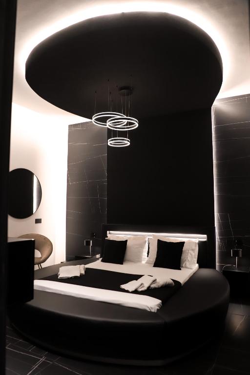 Postel nebo postele na pokoji v ubytování 115 Luxury Suite - Privitera