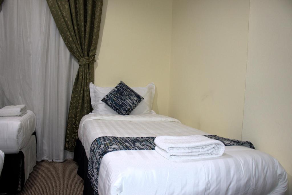 Postel nebo postele na pokoji v ubytování فندق لؤلؤة العنود مكة توصيل مجانا للحرم - Loulouat Al Anood Hotel Makkah Free shuttle service