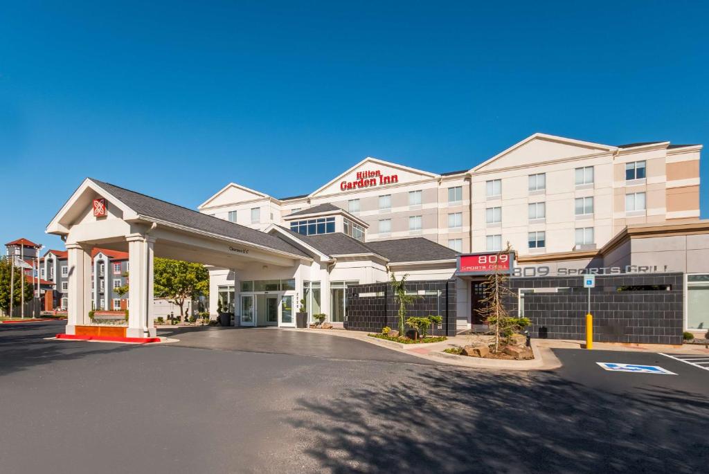 a rendering of a hotel with a parking lot at Hilton Garden Inn Oklahoma City Midtown in Oklahoma City