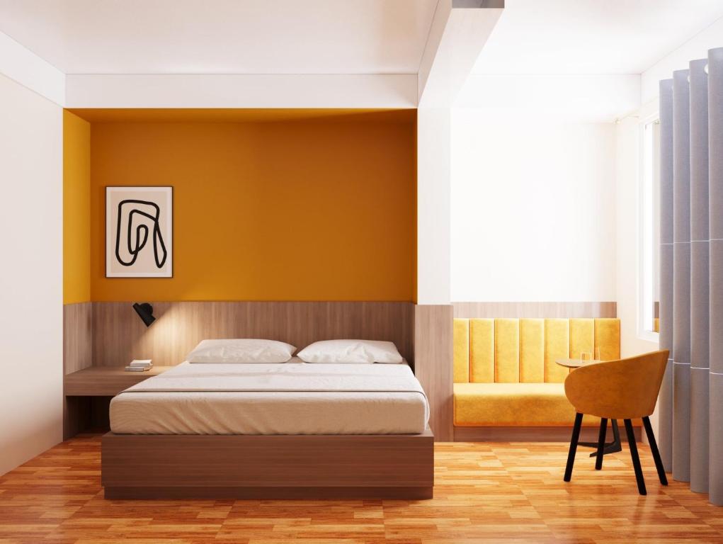 Кровать или кровати в номере FIRONA FLY HOTEL