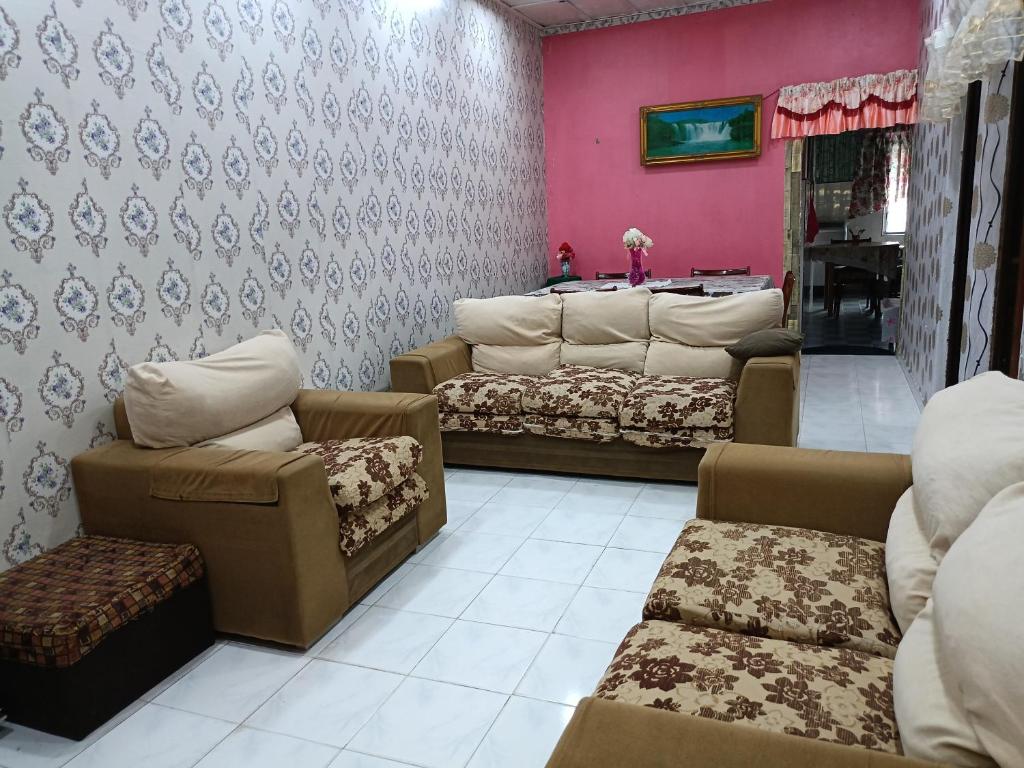 Area soggiorno di Homestay Bemban Batu Gajah