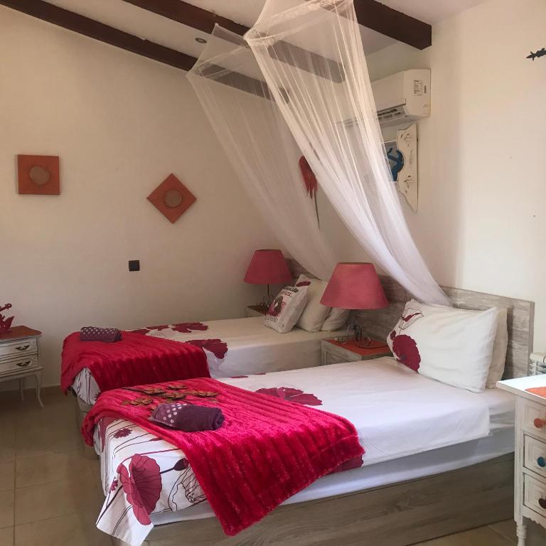 Postel nebo postele na pokoji v ubytování Villa Miramar