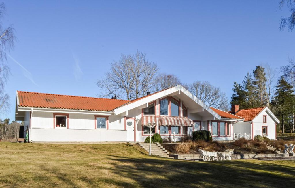 a large white house with a red roof at Beautiful Home In Sderkping With Wifi in Söderköping