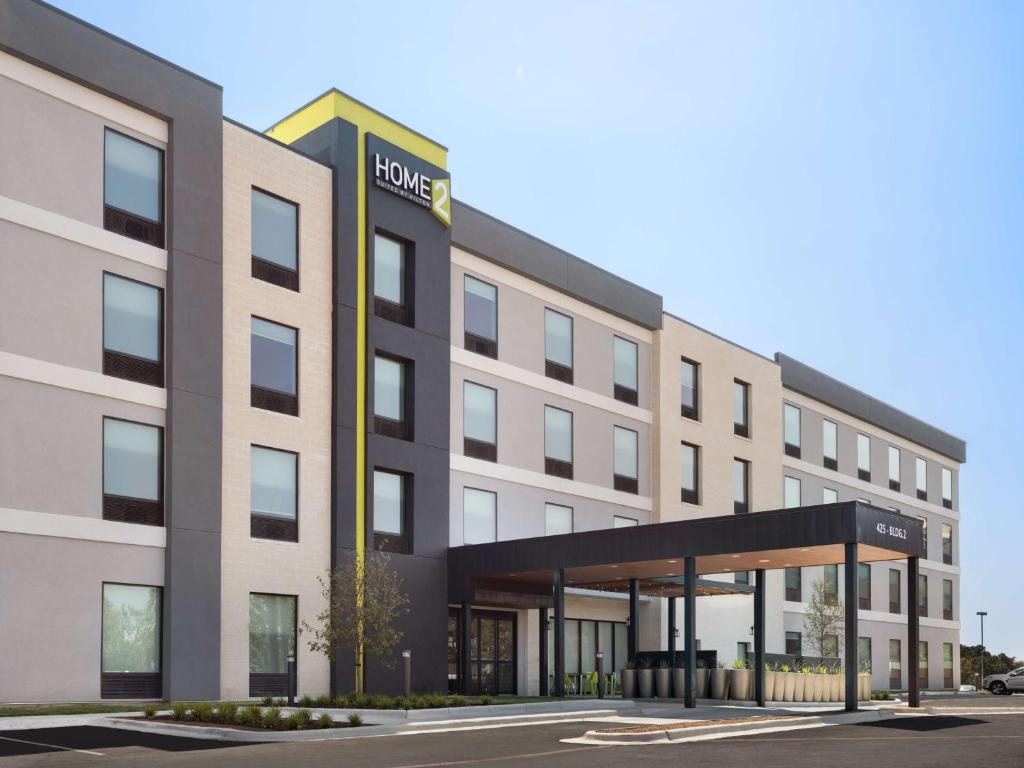 a rendering of a hotel with a building at Home2 Suites By Hilton Round Rock Medical Center in Round Rock