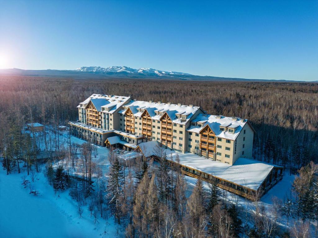 an aerial view of a resort in the snow at DoubleTree by Hilton Changbaishan Hot Spring in Antu