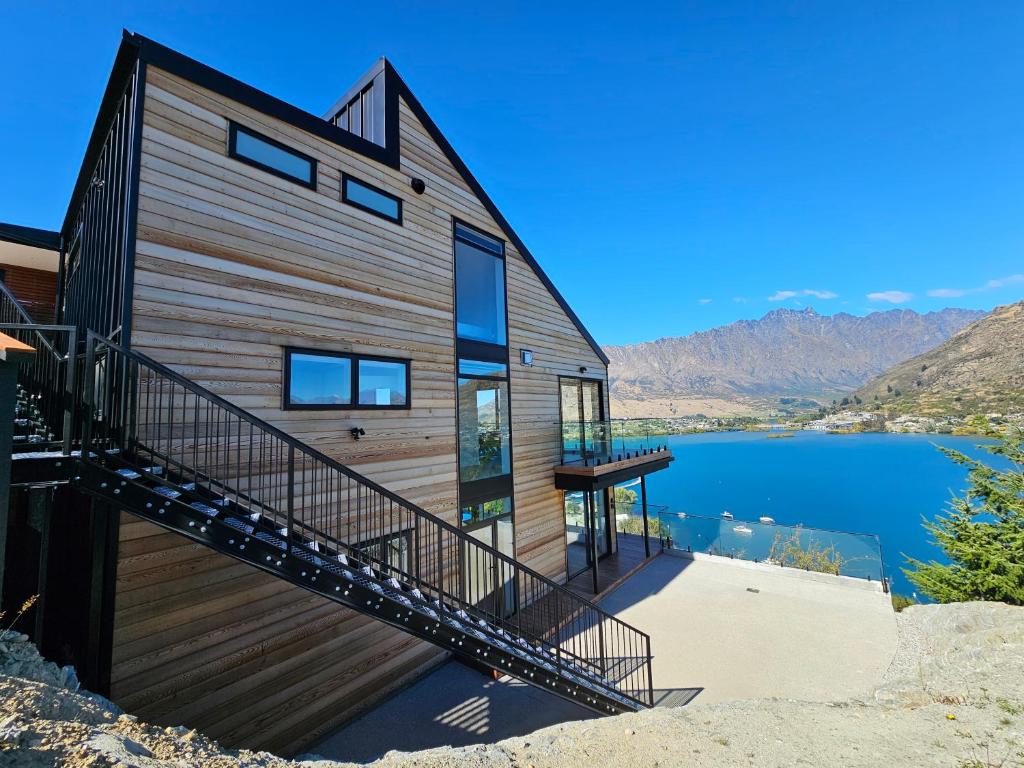 a house on the side of a lake at Elia's House in Queenstown