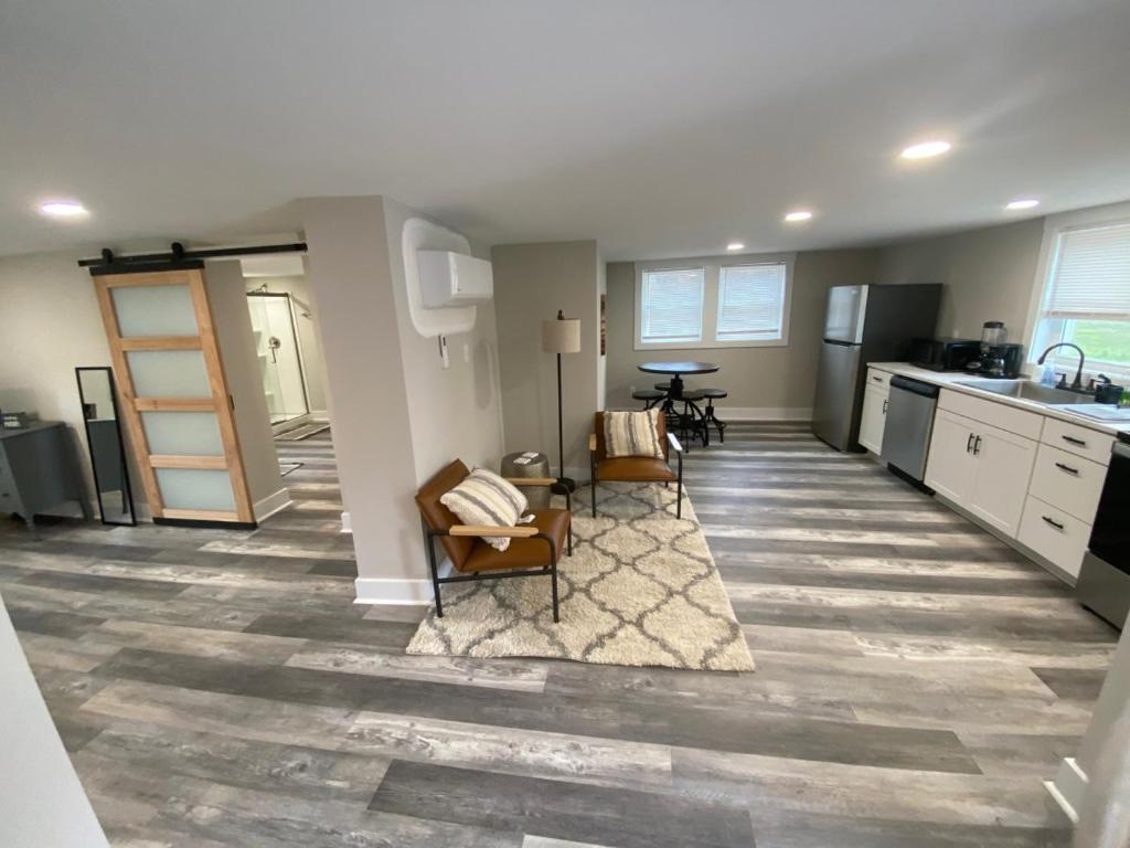 a kitchen with two chairs and a table in a room at Newly Renovated Lincolnton Downtown Rail Trail Apartment - Walk to Main St in Lincolnton
